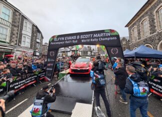 Elfyn Evans celebrates his title with a home event