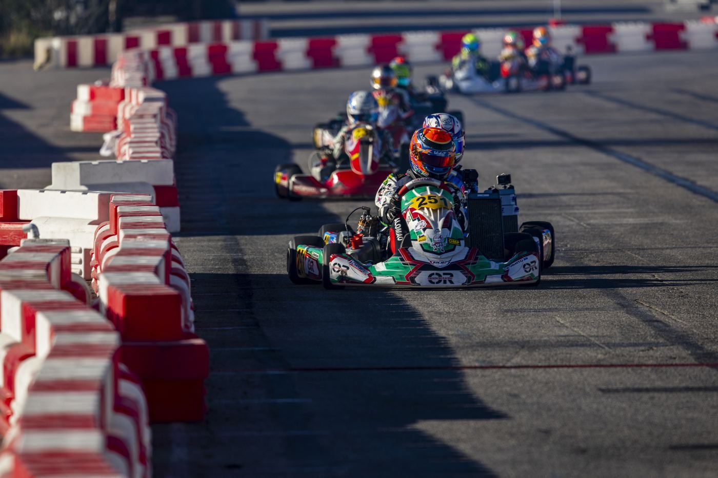 Karts running between the barriers of the street circuit